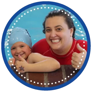 swimming instructor and swimmer smiling with thumbs up